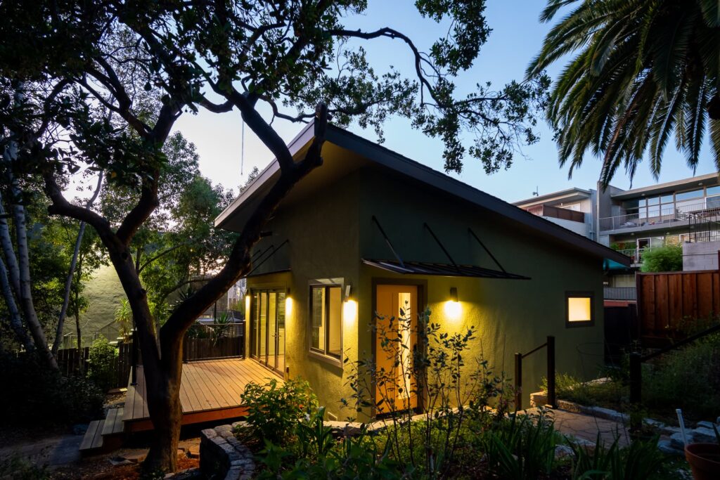 Detached ADU in Adams Point, Oakland, lit up at dusk